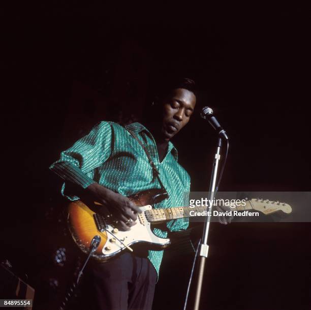 American blues guitarist and singer Buddy Guy performs live playing a Fender Stratocaster guitar on the American Folk Blues Festival tour in London...