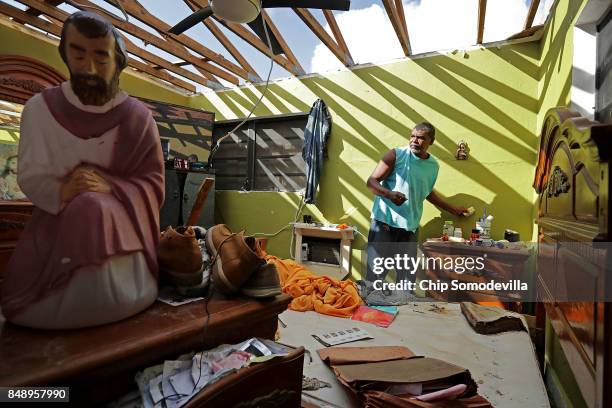 Carmelo Mota searches for tools in his destroyed bedroom more than a week after Hurricane Irma made landfall September 18, 2017 in Charlotte Amalie,...