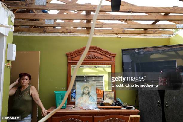 Eleanor Mota stands in her destroyed bedroom more than a week after Hurricane Irma made landfall September 18, 2017 in Charlotte Amalie, St Thomas,...