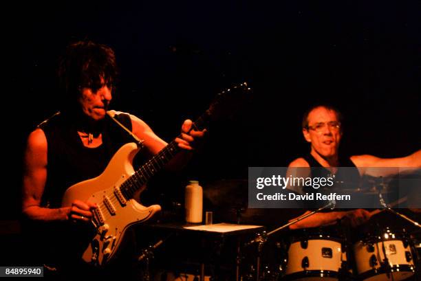 English rock guitarist Jeff Beck performs live on stage playing a Fender Signature Stratocaster guitar with drummer Vinnie Colaiuta at Ronnie Scott's...