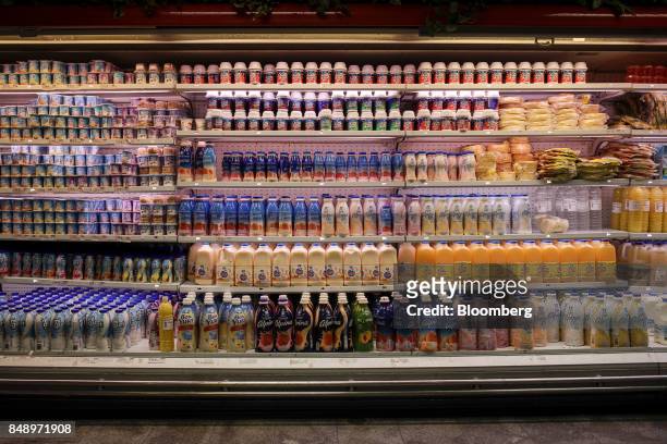 Dairy and juice products are displayed for sale at a supermarket in the Chacao district of Caracas, Venezuela, on Thursday, Aug. 24, 2017. The...