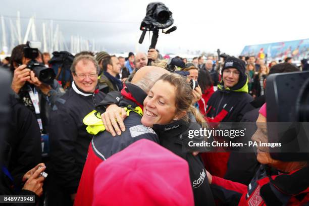 British yachtswoman Samantha Davies hugs her father Paul as mum Jenny looks on before leaving Les Sables d'Olonne, western France aboard her racing...