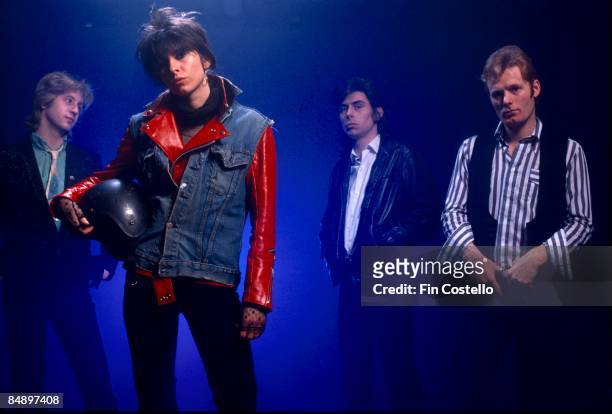 Photo of PRETENDERS and James HONEYMAN SCOTT and Chrissie HYNDE and Pete FARNDON and Martin CHAMBERS; Posed studio group portrait L-R James Honeyman...