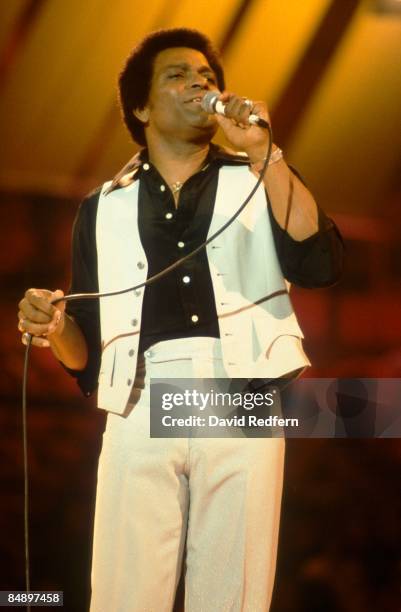 Photo of Charley PRIDE; Charley Pride performing on stage