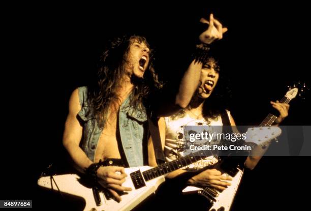 Photo of James HETFIELD and Kirk HAMMETT and METALLICA, James Hetfield and Kirk Hammett performing live onstage, playing Gibson Flying V guitars