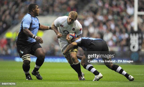 England's Chris Robshaw is tackled during the QBE International match at Twickenham Stadium, Twickenham.