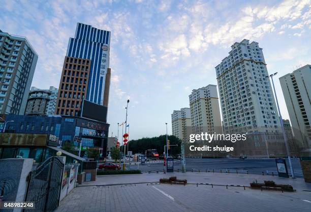 turpan city center sunrise - urban skyline xinjiang stock pictures, royalty-free photos & images