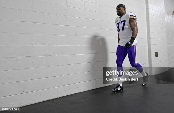 Everson Griffen of the Minnesota Vikings heads toward the field before the start of the game against the Pittsburgh Steelers at Heinz Field on...