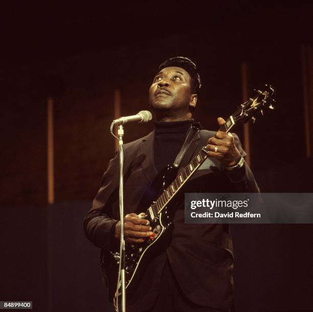 American blues singer and guitarist Muddy Waters performs live on stage with his blues band during the recording of the BBC Television show 'Jazz at...