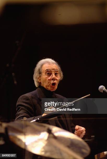 Photo of Lalo SCHIFRIN, Lalo Schifrin performing on stage, conducting the London Symphony Orchestra
