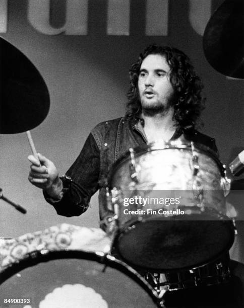 Photo of AVERAGE WHITE BAND and Robbie McINTOSH, Drummer Robbie McIntosh performing on stage