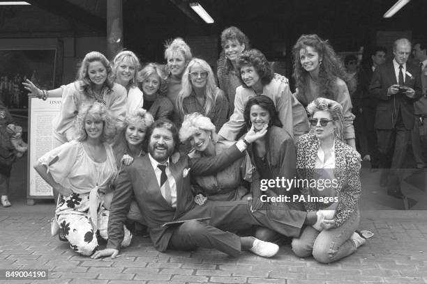 Dave Lee Travis is surrounded by some of the women who appear in his photography book A Bit of a Star. Back Row L-R: Unidentified, Janet Ellis,...