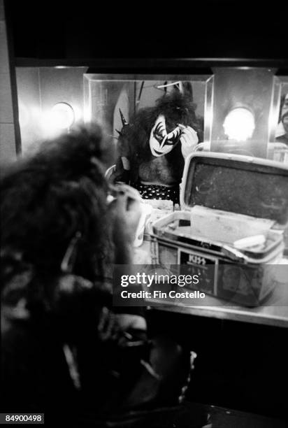 Photo of KISS and Gene SIMMONS, Gene Simmons backstage in dressing room putting on make up