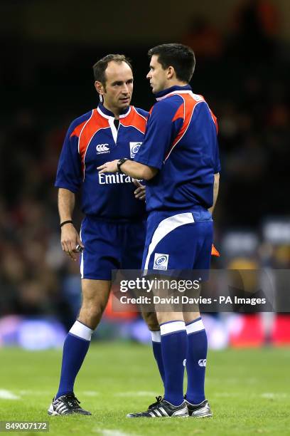 Referee Romain Poite talks to assistant George Clancy