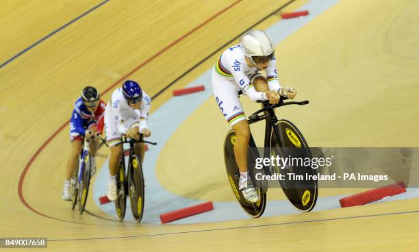 Great Britain's Laura Trott rides away from pursuit teamates Dani King and Elinor Barker in qualifying during day one of the UCI Track Cycling World...