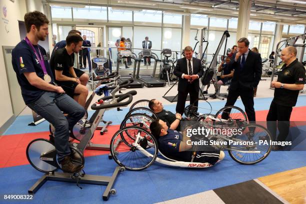 Prime Minister David Cameron meets injured soldiers Staff Sgt Steve Arnold and Sgt Simon Harmer Jonpaul Nevin and Jon-Allan Butterworth at Tedworth...