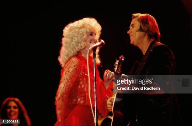 Country Artists Tammy Wynette and George Jones perform live on stage at the Country Music Festival, Wembley Arena, London in April 1981.