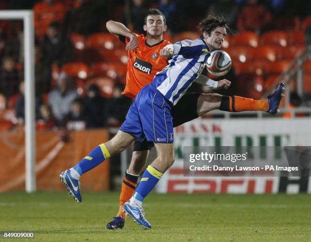 Dundee's Gavin Gunning and Kilmarnock's Cillian Sheridan fight for the ball during the Clydesdale Bank Scottish Premier League match at Tannadice...