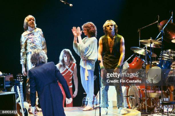 Photo of YES and Rick WAKEMAN and Steve HOWE and Jon ANDERSON and Alan WHITE, L-R Rick Wakeman, Steve Howe, Jon Anderson and Alan White on stage at...