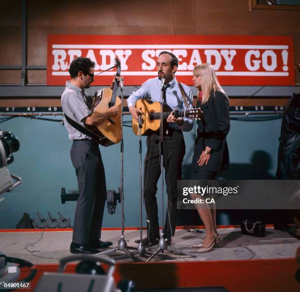 Photo of PETER, PAUL & MARY; Group performing on tv show L-R Peter Yarrow, Noel "Paul" Stookey and Mary Travers