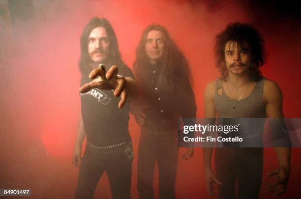 Photo of MOTORHEAD and LEMMY and Eddie CLARKE and Phil TAYLOR; Posed studio group portrait L-R Lemmy, Eddie Clarke and Phil Taylor