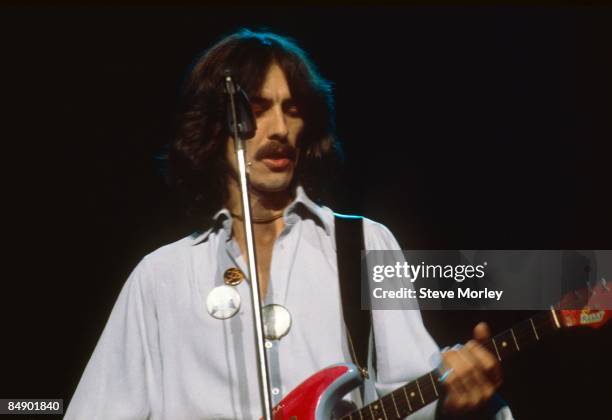 Photo of George HARRISON; George Harrison performing on stage, Dark Horse Tour