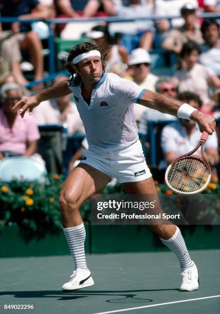 Guillermo Vilas of Argentina in action during a men's singles match at the US Open Tennis Championships at Flushing Meadow in New York City, circa...