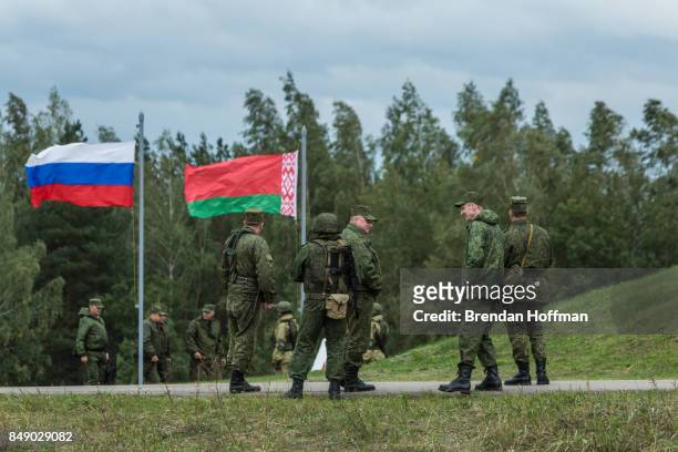 Russian and Belarusian soldiers watching the Zapad 2017 military exercises at the Asipovichy military training ground on September 18, 2017 in in...