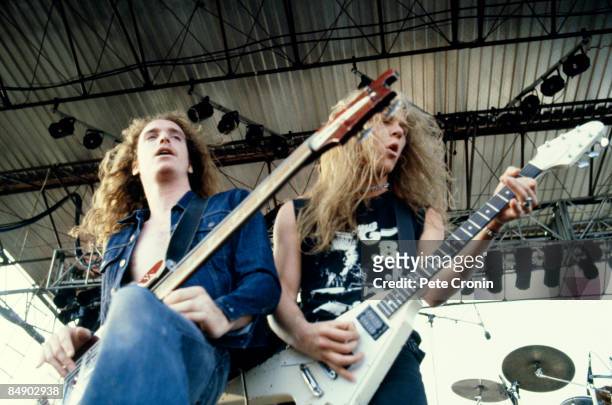 Photo of METALLICA and James HETFIELD and Cliff BURTON; Cliff Burton and James Hetfield performing on stage