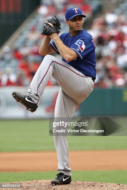 Pitcher Miguel Gonzalez of the Texas Rangers pitches during the fifth inning of the MLB game against the Los Angeles Angels of Anaheim at Angel...