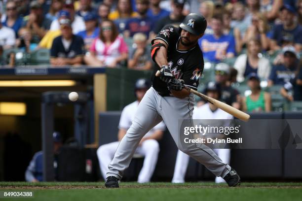 Mike Aviles of the Miami Marlins hits a single in the seventh inning against the Milwaukee Brewers at Miller Park on September 17, 2017 in Milwaukee,...