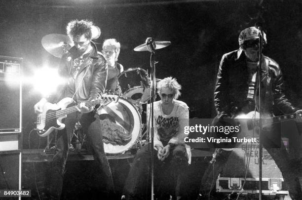 Photo of Johnny ROTTEN and SEX PISTOLS and Sid VICIOUS and Steve JONES; L-R: Sid Vicious, Paul Cook , Johnny Rotten , Steve Jones, performing on set...