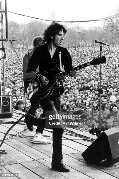 British musician Mick Jones of The Clash performing live onstage at Rock against Racism carnival, Victoria Park Hackney, playing Gibson Les Paul,...
