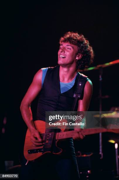 Photo of Bruce SPRINGSTEEN; Bruce Springsteen performing on stage - Chicken Scratch tour at the Civic Center