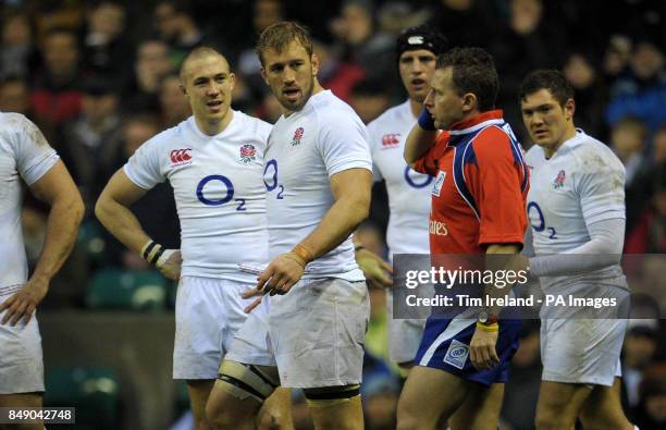 England captain Chris Robshaw speaks with referee Nigel Owens as a decision is pending on a South Africa try during the QBE International match at...