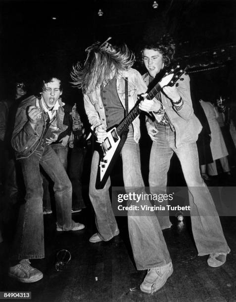 Photo of FANS and HEAVY METAL and HEADBANGING and AIR GUITARIST, Fans at an Iron Maiden Concert