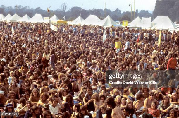 Photo of READING FESTIVAL, Crowds of festival-goers sitting on grass at Reading Festival in the 1970s