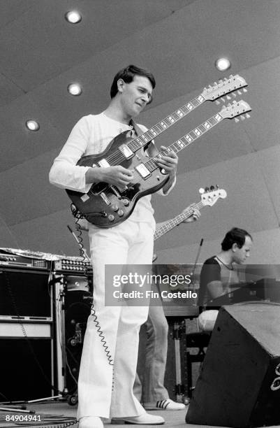 Photo of John McLAUGHLIN and MAHAVISHNU ORCHESTRA, John McLaughlin performing on stage, Gibson EDS-1275 twin necked guitar