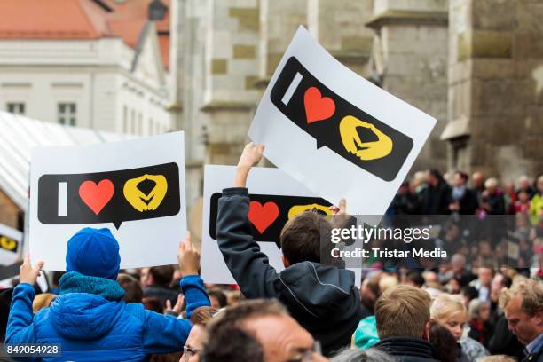 People attend a campain of german chancellor Angela Merkel on September 18, 2017 in Regensburg, Germany.