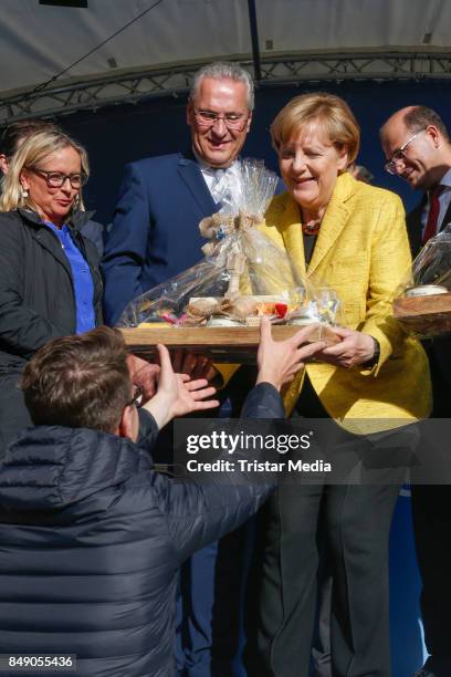 Joachim Herrmann and German chancellor Angela Merkel campains on September 18, 2017 in Regensburg, Germany.