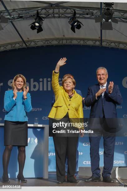 Astrid Freudenstein, German chancellor Angela Merkel and Joachim Herrmann campain on September 18, 2017 in Regensburg, Germany.