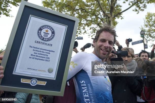 Mark Beaumont poses with his Guinness World Records after he arrived in Paris after completing 79 days round the world on September 18, 2017 in...