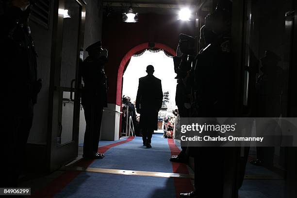 Barack H. Obama holds in a crowded hallway backstage at the Capital moments before walking out to be sworn in by Chief Justice John Roberts as the...