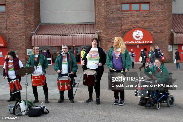 Guarana drummers perform outside Pittodrie Stadium before the match