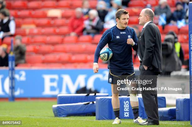 Scotland head coach Andy Robinson talks with Rory Lawson before the game before the game