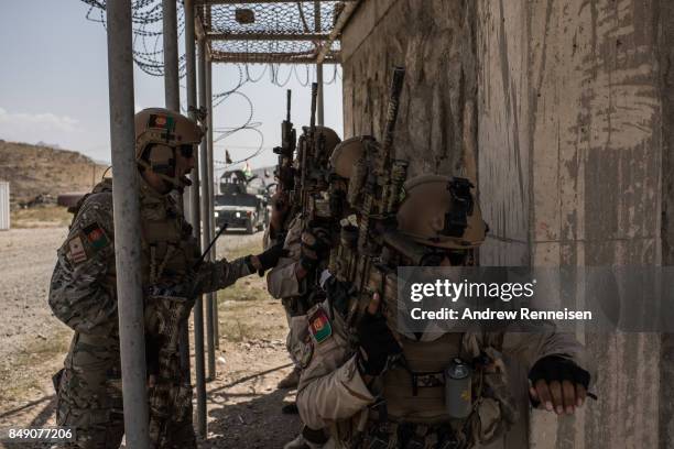 Members of Afghanistan's Crisis Response Unit 222, an Afghan Special Police Unit, participate in a training slowed down for the media on September 7,...