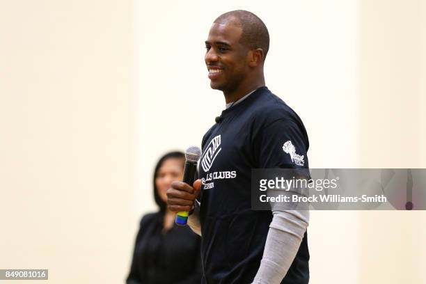 Chris Paul of the Houston Rockets interacts with kids during the NBA Cares Winston Salem State farm Assist Dedication event in Winston Salem, North...