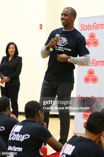 Chris Paul of the Houston Rockets interacts with kids during the NBA Cares Winston Salem State farm Assist Dedication event in Winston Salem, North...