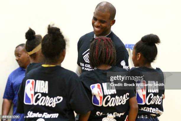 Chris Paul of the Houston Rockets interacts with kids during the NBA Cares Winston Salem State farm Assist Dedication event in Winston Salem, North...