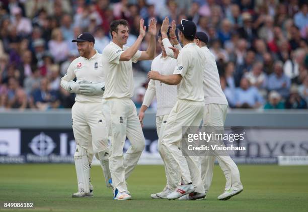 Toby Roland-Jones of England celebrates taking the wicket of Jermaine Blackwood during Day One of the 3rd Investec Test Match between England and...